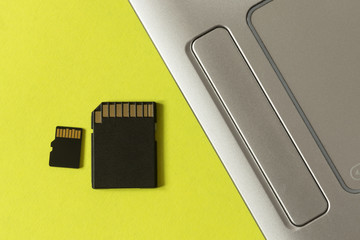 SD card with adapter near the laptop