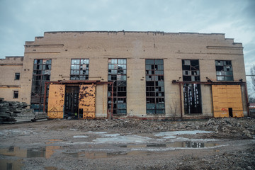 Abandoned ruined industrial building waiting for demolition. Territory of abandoned industrial area...