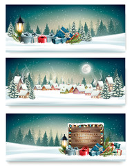 Three Holiday Christmas banners with a winter village and presents. Vector