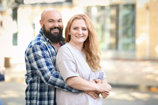 Overweight Couple On City Street