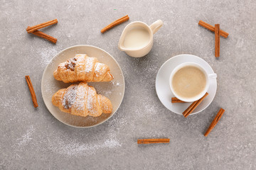 Composition with tasty croissants on grey background