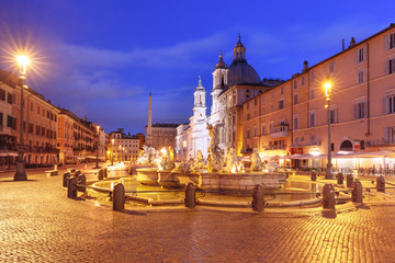 Fototapeta premium The Fountain of Neptune on the famous Piazza Navona Square at night, Rome, Italy.