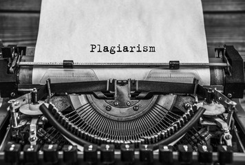 plagiarism, Copyright printed on an old typewriter. Black retro vintage aged typewriter. Close up.