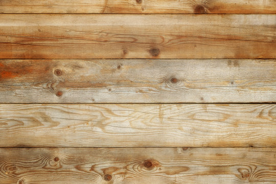 Old light pine weathered distressed damaged stained wood grain planked wall rustic background texture photo
