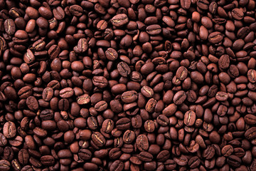 Coffee bean dark roasted scattered background texture photo