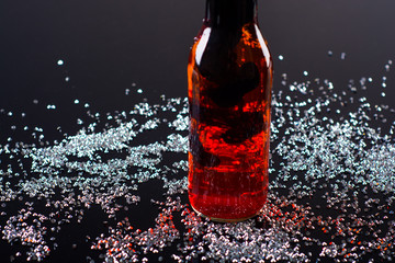 Red and black ink in water bottle