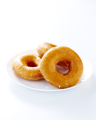 Donut isolated on a white plate