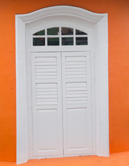 window on retro orange wall