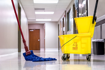 Mopping wet floor in hallway - 184365643