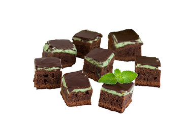 Homemade dark chocolate brownies topping  with mint.