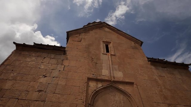Medieval chapel, clouds timelapse over the Christian Church