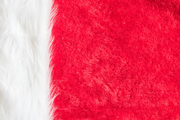Red velvet texture background and white soft fluffy  fur part of Christmas Santa Claus fashion...