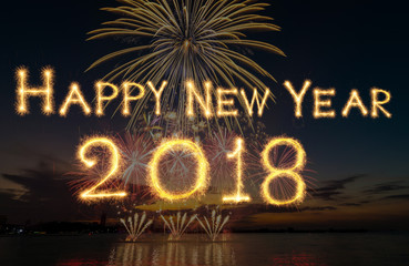 Happy new year 2018 written with Sparkle firework on fireworks with dark background, celebration...
