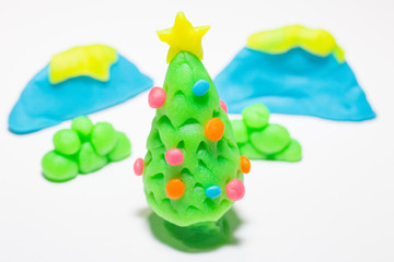 christmas tree play dough  close up image on white background.