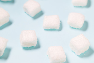 Marshmallow candy on blue background