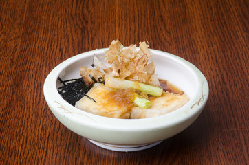 japanese cuisine. fried tofu on the background