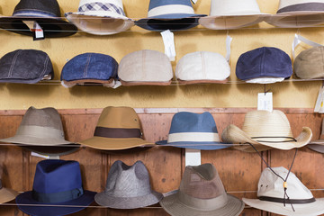 fedora hats hanging on the wall of country shop