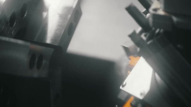 Automated replacement of parts that are machined on a lathe