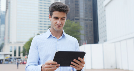 Hispanic businessman use of tablet computer