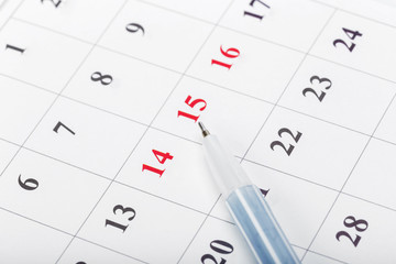 Check out the dates in a business calendar concept