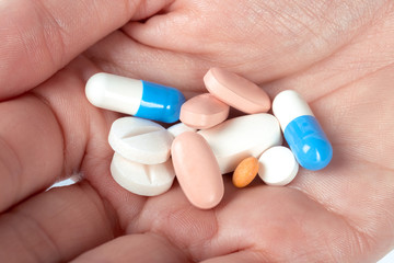 pills in woman hand
