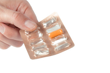 pills in woman hand