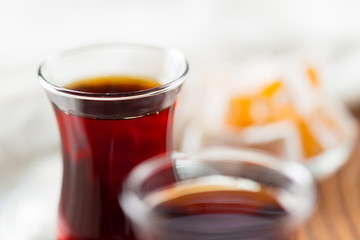 Red tea in turkish glasses on a wooden table