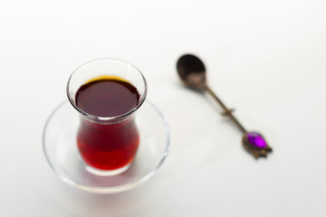 Turkish tea in traditional glass isolated on white background