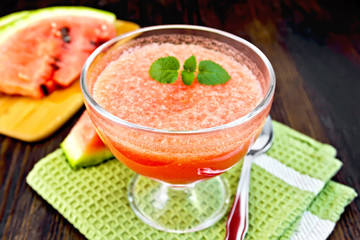 Jelly airy watermelon with mint on dark board