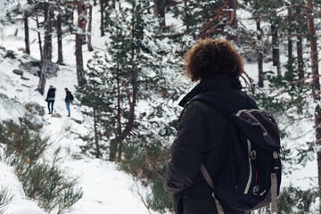 Woman standing in snowed mountain