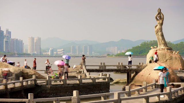day time zhuhai city famous fisher girl monument crowded panorama 4k timelapse china
