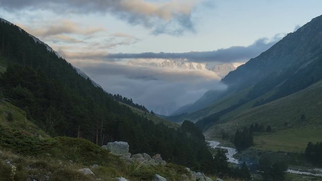 Russia, Republic of Kabardino-Balkaria, time lapse. Summer in the mountains of the Caucasus. Formation and movement of clouds over mountains peaks.