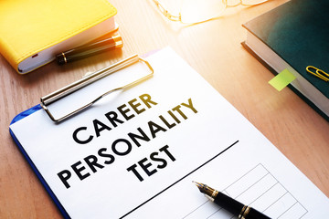 Clipboard with Career personality test on an office desk. Assessments concept.