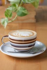 Coffee on a wooden table in a coffee shop