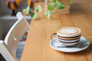 Coffee on a wooden table in a coffee shop