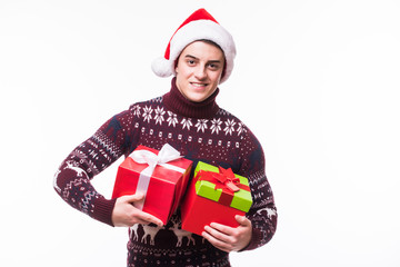 Happy boy with santa hat holding a gift isolated on white background