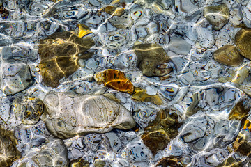 colored stones below sea level near the coast of the Mediterranean Italian island of Elba