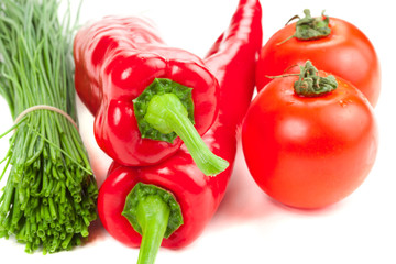 Red sweet peppers with fresh scallions and tomato
