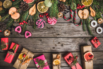 New Year composition of flowers, gifts on a wooden table. Christmas background. Flat lay.Top view