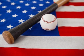 Baseball bat and ball on American flag