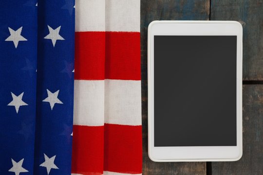 Digital tablet on American flag