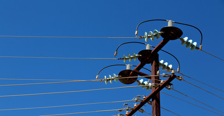 power line with electrical pole in the clear sky