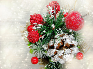 Obraz na płótnie Canvas christmas decoration winter berries apple and snow on wooden background