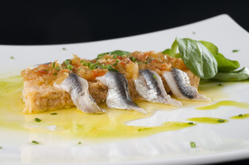 Pastel de pescado con boquerones