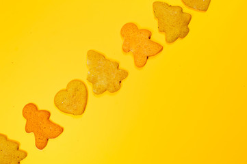 Christmas cookies different form on a yellow background