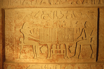 Ancient egypt art and hieroglyphs carved on the stone
