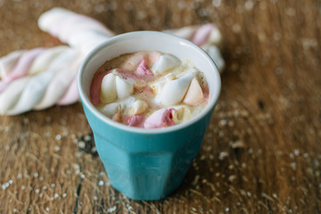 Coffee with marshmallow in a light blue cup
