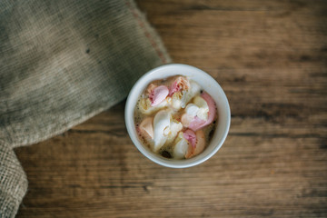 Coffee with marshmallow in a light blue cup