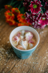 Coffee with marshmallow in a light blue cup