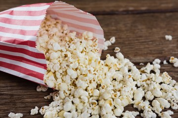 Close-up of spilled popcorn on wooden table